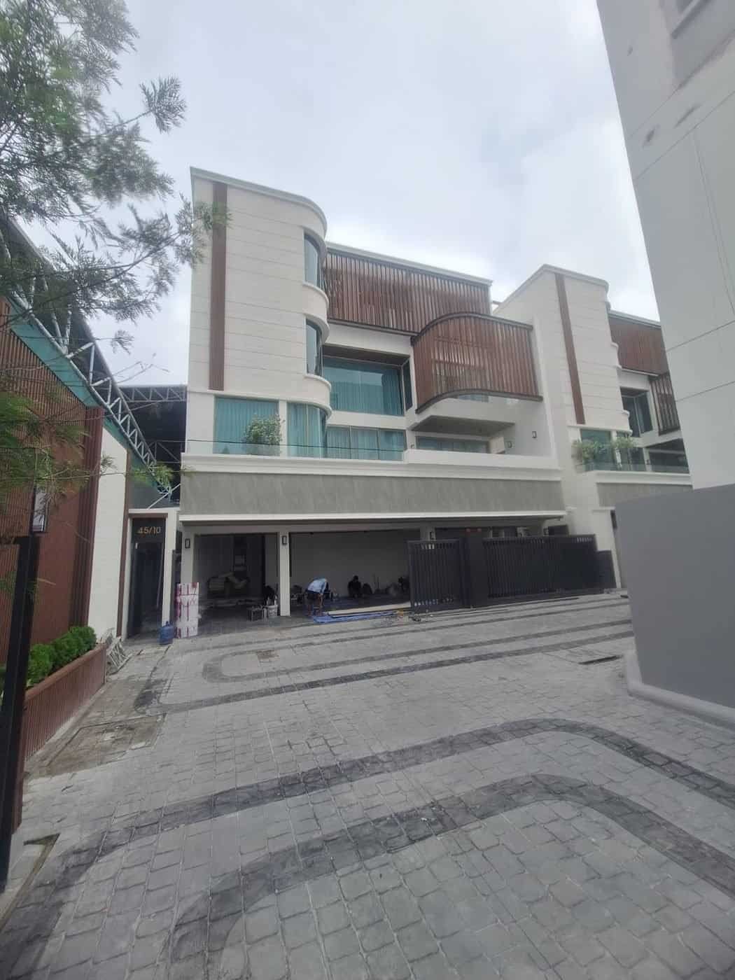 Exterior of a townhome job site where the workroom team installed window treatments